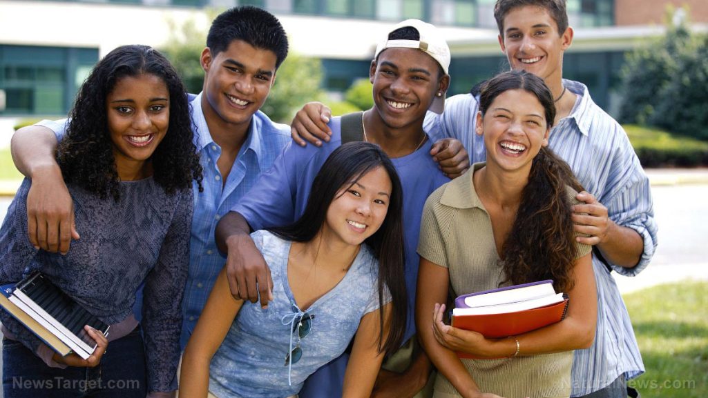 Student and College Readiness Group of six diverse students smiling outdoors, holding books and standing together.